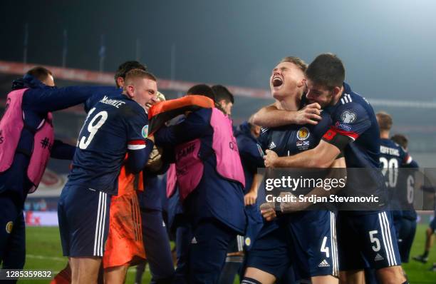 Scott McTominay of Scotland and Declan Gallagher of Scotland celebrate after the UEFA EURO 2020 Play-Off Final between Serbia and Scotland at Rajko...