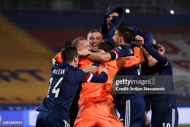 David Marshall of Scotland celebrates with Leigh Griffiths of Scotland and Scott McTominay of Scotland and his team as they celebrate after their...