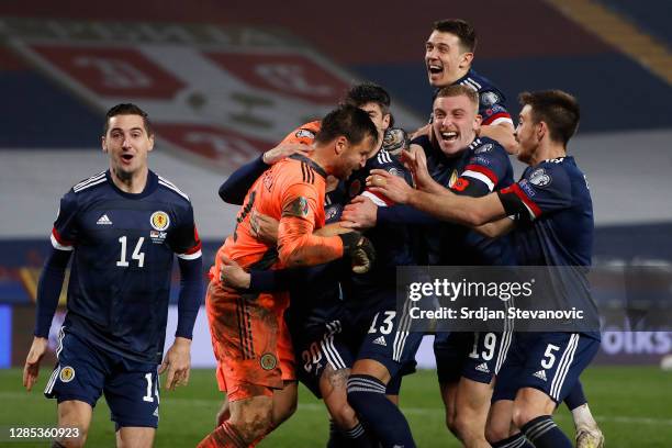 David Marshall of Scotland celebrates with Leigh Griffiths of Scotland and Scott McTominay of Scotland and his team as they celebrate after their...