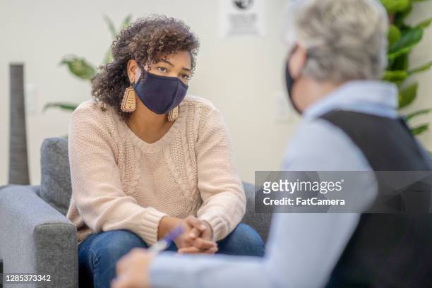 patient wearing a mask during therapy session - alternative therapy stock pictures, royalty-free photos & images