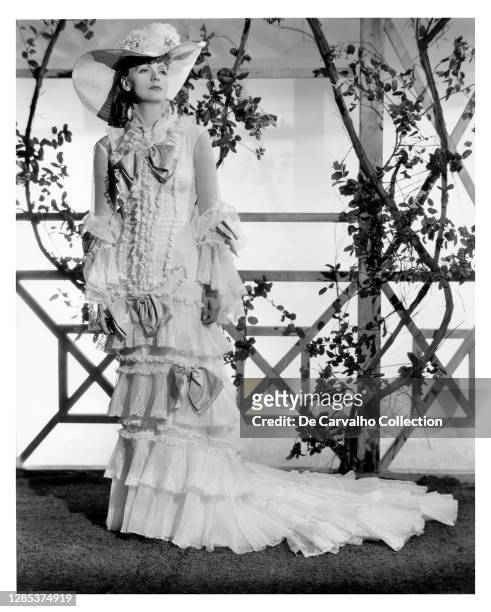 Swedish Actress Greta Garbo standing in an elegant dress in a publicity shot from the movie 'Anna Karenina' United States.