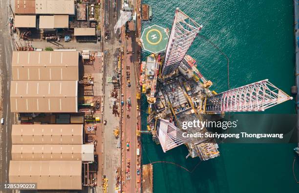 aerial view jack up rig for exploration oil in the sea, repairing in shipyard. - swamp gas stock pictures, royalty-free photos & images