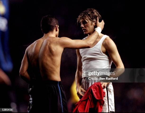 World Cup rivals Diego Simeone of Inter Milan and David Beckham of Manchester United exchange shirts after the UEFA Champions League quarter-final...