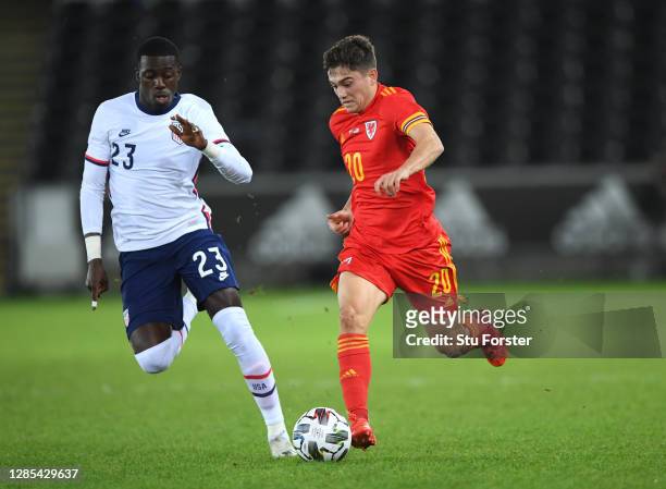 Wales player Daniel James bursts past the challenge of Timothy Weah during the international friendly match between Wales and the USA at Liberty...