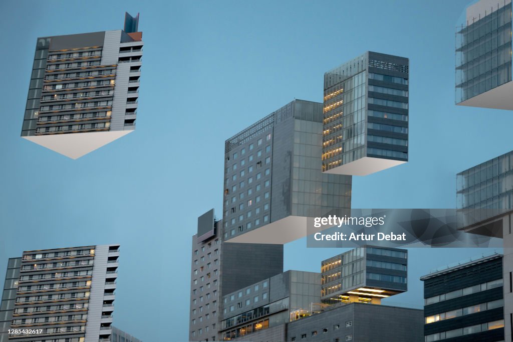 Building blocks levitating in the city during blue hour like 3D puzzle.