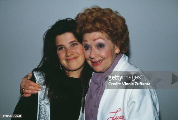American actress Daphne Zuniga with American actress and comedian Lucille Ball , who wears a white jacket with 'Lucy' written in red, with Ball...