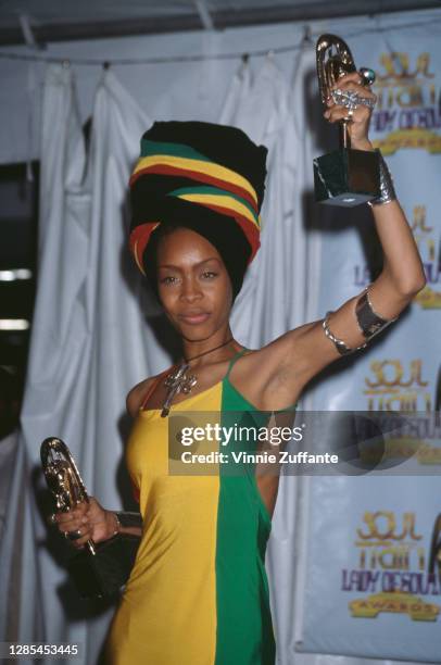 American singer-songwriter Erykah Badu, wearing a dress and matching headwrap in green, gold and red, attends the 4th Annual Soul Train Lady of Soul...