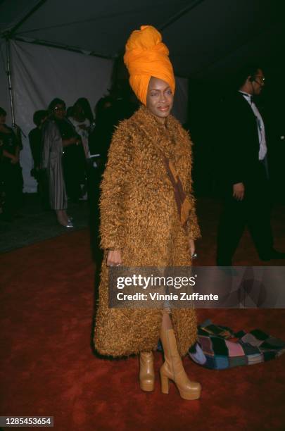 American singer-songwriter Erykah Badu wearing an orange headwrap attends the 29th Annual NAACP Image Awards, held at the Pasadena Civic Auditorium...