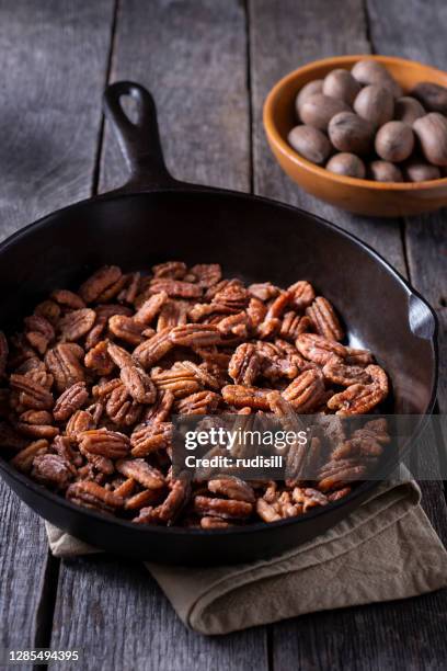 glazed pecans - candied pecans stock pictures, royalty-free photos & images