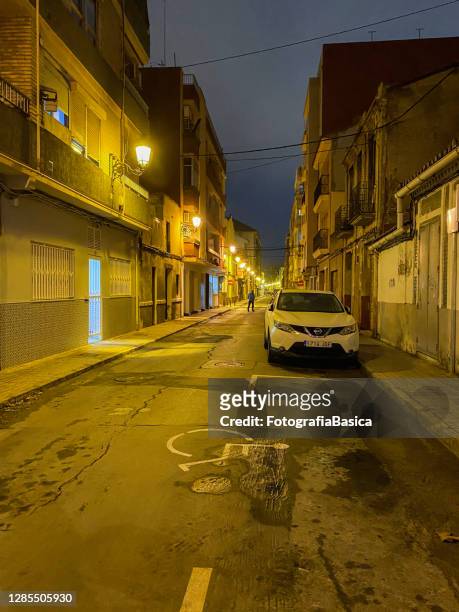 solitary street at night in valencia, spain - narrow icon stock pictures, royalty-free photos & images