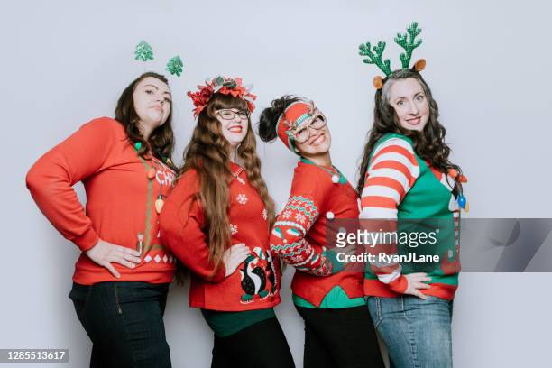 christmas ugly sweater party with adult friends - ugly christmas sweater party stock pictures, royalty-free photos & images