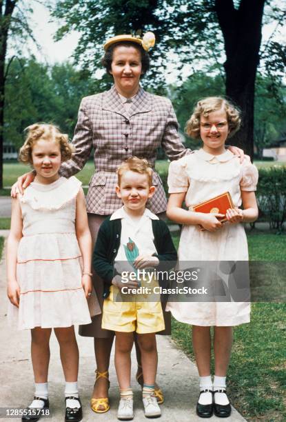 1950s Mother And Three Children All Dressed Up Posing For Photo Outdoors