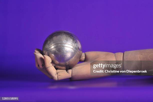 dolls hand with metall ball - boule noel stock pictures, royalty-free photos & images