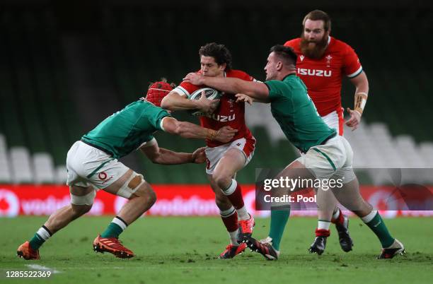 Lloyd Williams of Wales is tackled by Josh van der Flier and Ronan Kelleher of Ireland during the Autumn Nations Cup 2020 match between Ireland and...