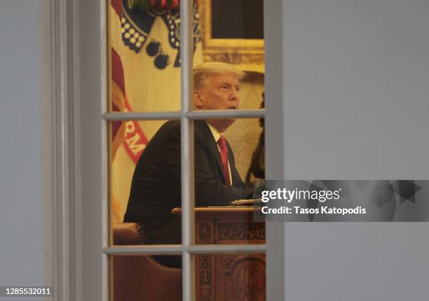 President Donald Trump sits in the oval Office after speaking about Operation Warp Speed in the Rose Garden at the White House on November 13, 2020...