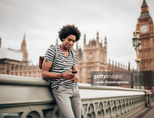 tourist in london using the phone - big ben stock pictures, royalty-free photos & images