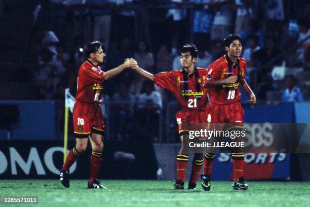 Dragan Stojkovic of Nagoya Grampus Eight celebrates scoring his side's first goal with his team mates Tetsuya Okayama and Kenji Fukuda during the...