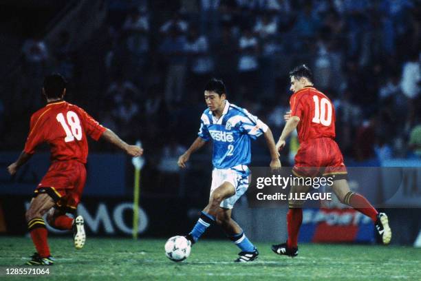 Hideto Suzuki of Jubilo Iwata controls the ball under pressure of Kenji Fukuda and Dragan Stojkovic of Nagoya Grampus Eight during the J.League...