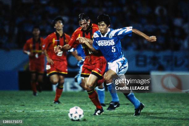 Dragan Stojkovic of Nagoya Grampus Eight and Makoto Tanaka of Jubilo Iwata compete for the ball during the J.League second stage match between Jubilo...