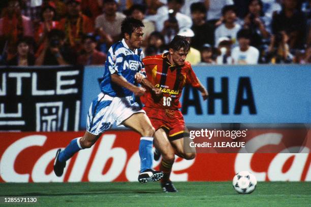 Dragan Stojkovic of Nagoya Grampus Eight and Takuma Koga of Jubilo Iwata compete for the ball during the J.League second stage match between Jubilo...