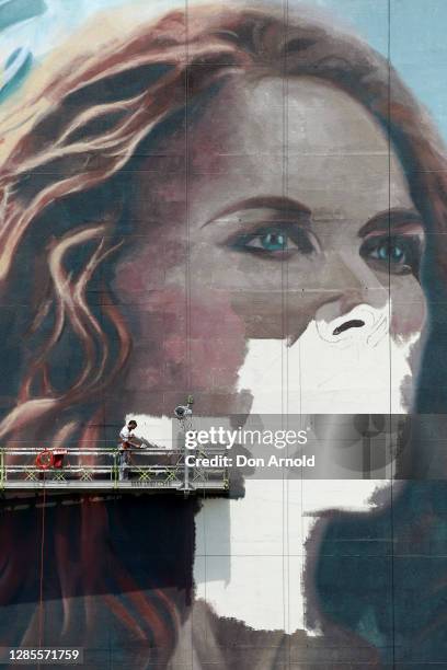 Finishing touches are applied to the portait as seen from the Zenith building on November 14, 2020 in Sydney, Australia. A team of 11 artists have...