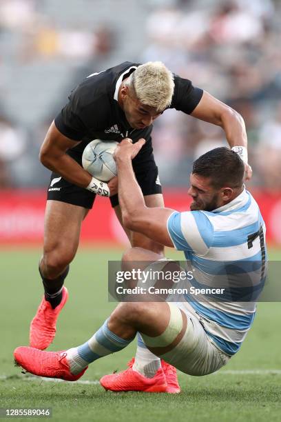 Rieko Ioane of the All Blacks fends off Pablo Matera of Argentina during the 2020 Tri-Nations rugby match between the New Zealand All Blacks and the...