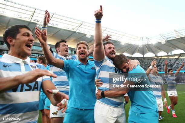 Domingo Miotti of the Pumas, Julian Montoya of the Pumas, and Sebastian Cancelliere of the Pumas celebrate winning the 2020 Tri-Nations rugby match...