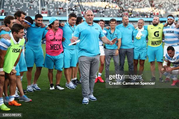 Argentina head coach Mario Ledesma talks to his players in a huddle after winning the 2020 Tri-Nations rugby match between the New Zealand All Blacks...