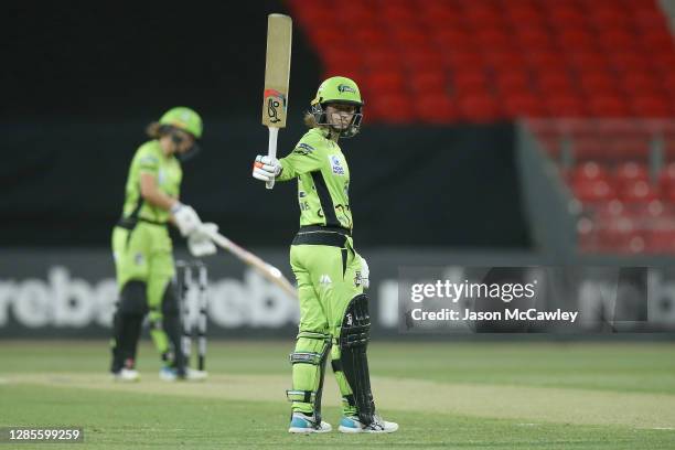 Rachael Haynes of the Thunder celebrates after reaching her half century during the Women's Big Bash League WBBL match between the Sydney Thunder and...