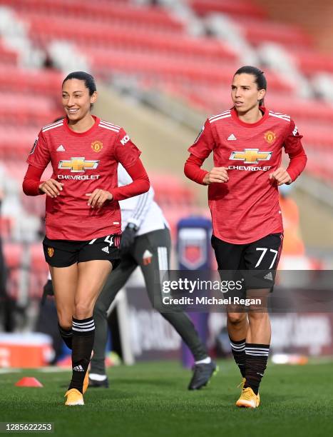 Tobin Heath and Christen Press of Manchester United speak to each other prior to the Barclays FA Women's Super League match between Manchester United...