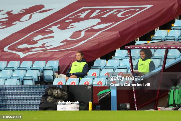 Lucy Whipp and Destiny Toussaint of Birmingham look on from the sidelines during the Barclays FA Women's Super League match between Aston Villa Women...