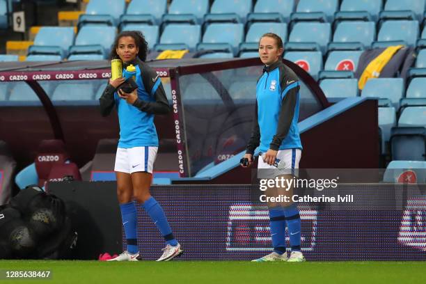 Destiny Toussaint and Lucy Whipp of Birmingham look on from the sidelines during the Barclays FA Women's Super League match between Aston Villa Women...