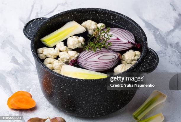 fresh vegetable soup in a saucepan. vegetable broth. - bouillon stock pictures, royalty-free photos & images