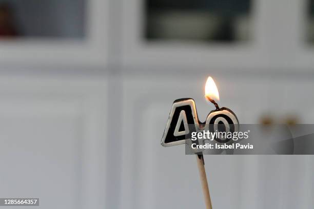 close-up of 40 birthday candle - 40 birthday foto e immagini stock