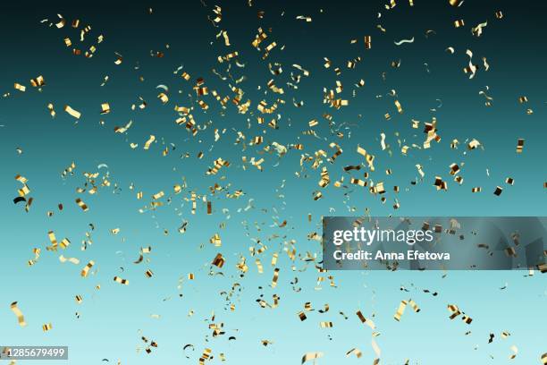 falling golden confetti. new year party concept - blue confetti stock pictures, royalty-free photos & images