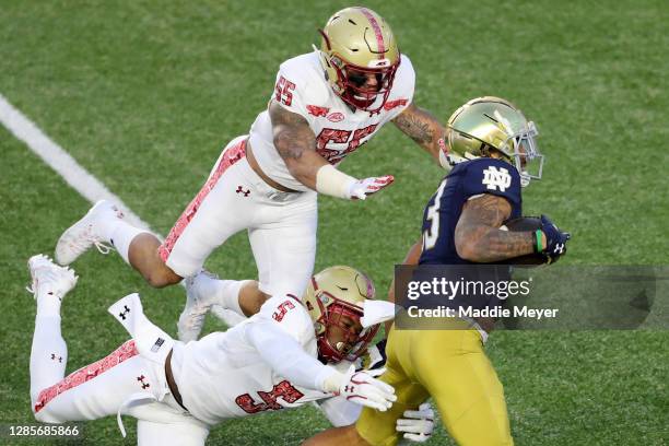 Isaiah McDuffie of the Boston College Eagles and Deon Jones tackle Kyren Williams of the Notre Dame Fighting Irish at Alumni Stadium on November 14,...