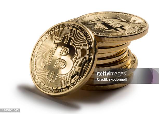 bitcoin stack on white background - cryptocurrency stock pictures, royalty-free photos & images