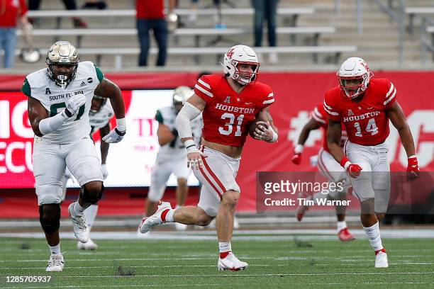 Derek Parish of the Houston Cougars returns an interception for a touchdown in the second half against the South Florida Bulls on November 14, 2020...