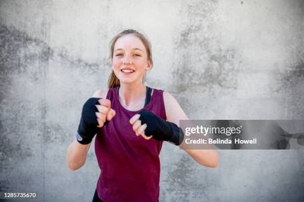 portrait of a female, teenage martial arts fighter - kids boxing stockfoto's en -beelden