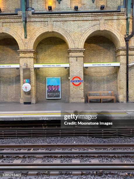 notting hill gate underground station in bayswater, london - london underground poster stock-fotos und bilder