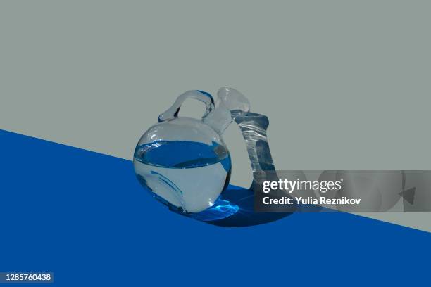 water in carafe on the blue-beige background - carafe stock pictures, royalty-free photos & images