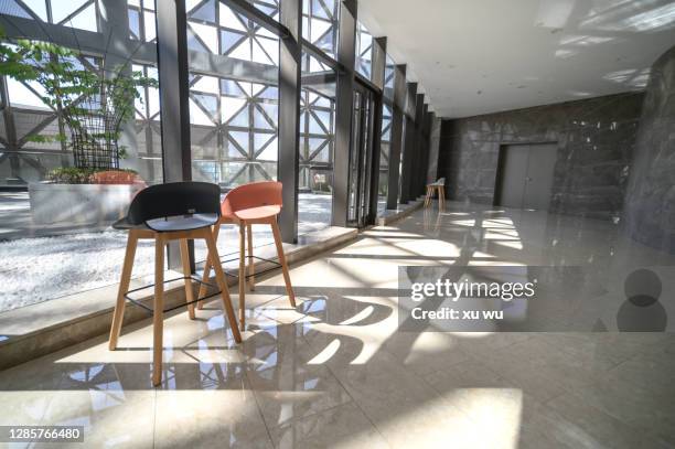 rest chairs in the office area - curtain wall facade stock pictures, royalty-free photos & images