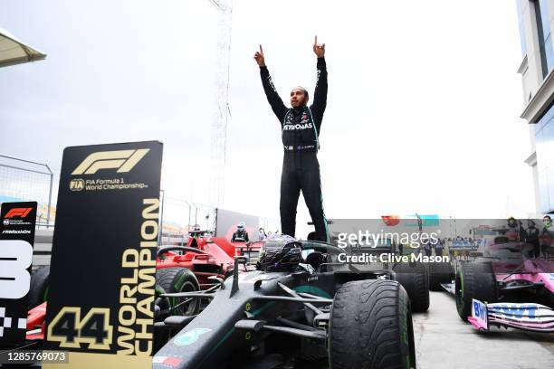 Race winner Lewis Hamilton of Great Britain and Mercedes GP celebrates winning a 7th F1 World Drivers Championship in parc ferme during the F1 Grand...