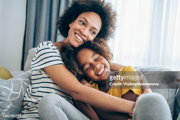 mother and little daughter at home. - love emotion stock pictures, royalty-free photos & images
