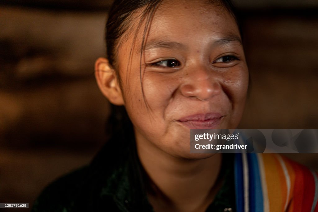 A Fine Art Portrait Of A Young Teenage Native American Girl, Trying Not To Laugh,