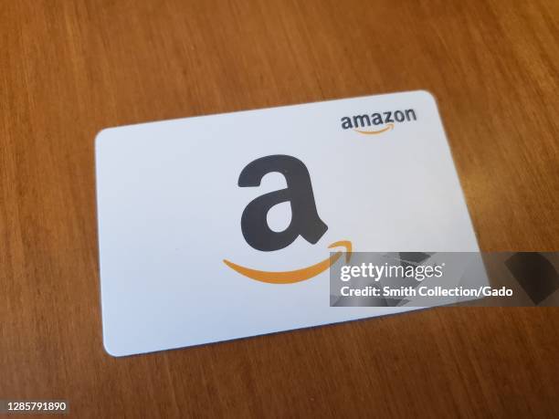 Close-up of a white Amazon gift card featuring the Amazon logo in San Ramon, California, USA, November 8, 2020.