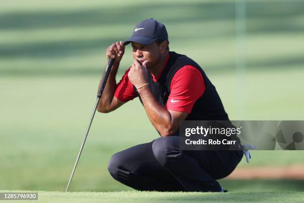 Tiger Woods of the United States lines up a putt on the seventh green during the final round of the Masters at Augusta National Golf Club on November...