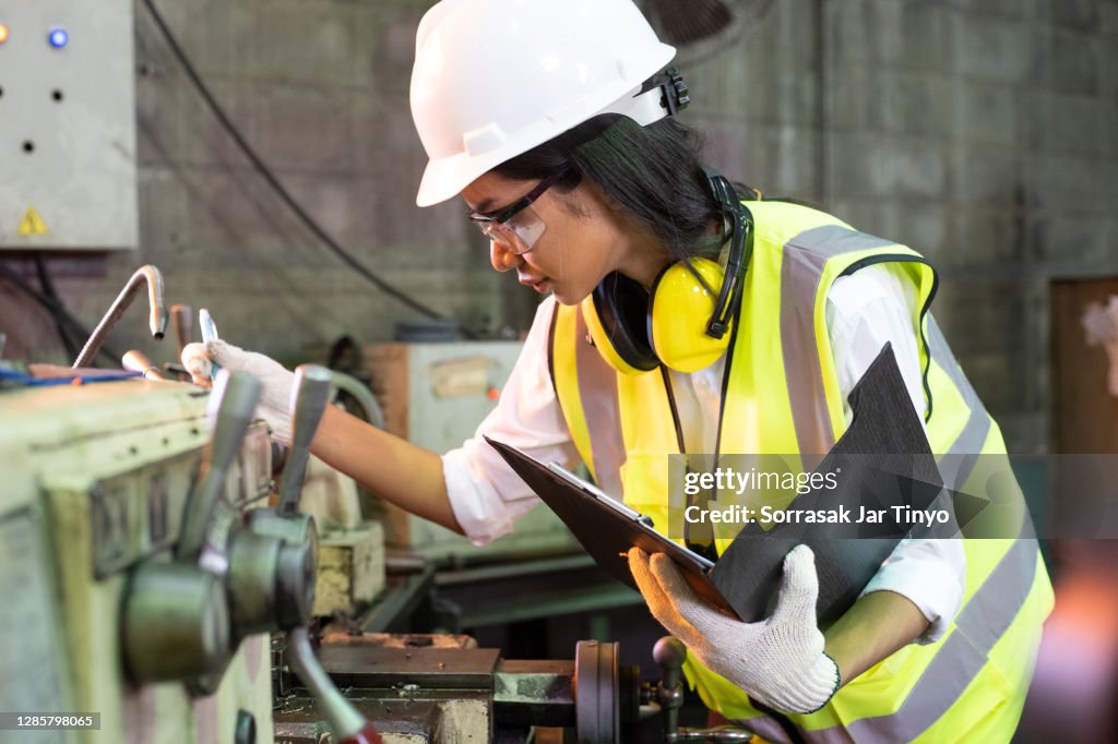 Cheaking Machine Before Using Young Women Engineer And Inspector Checking Lathe Machine From ...