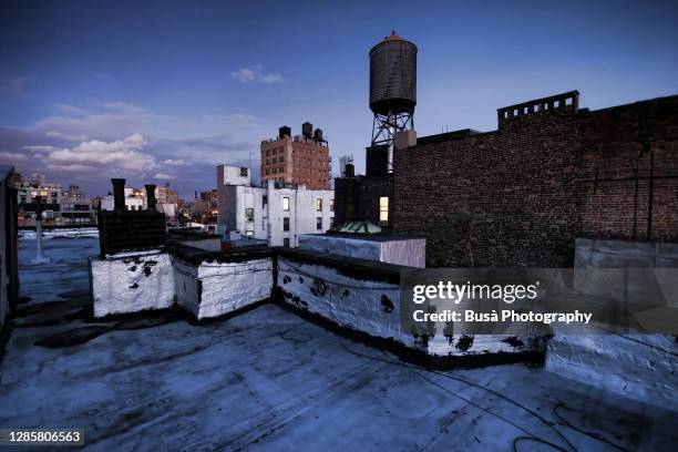 panoramic view towards from rooftop in manhattan, at twilight. new york city, usa - rooftop at night stock pictures, royalty-free photos & images