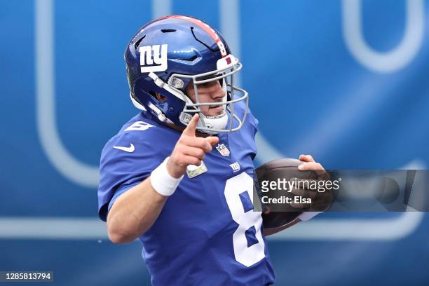 Daniel Jones of the New York Giants reacts as he runs the ball in for a touchdown during the first half against the Philadelphia Eagles at MetLife...